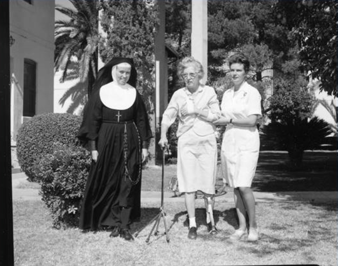 Historic photo of nun and a rehab patient