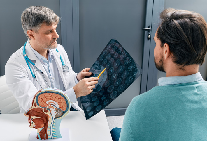 Doctor reviewing brain MRI with patient
